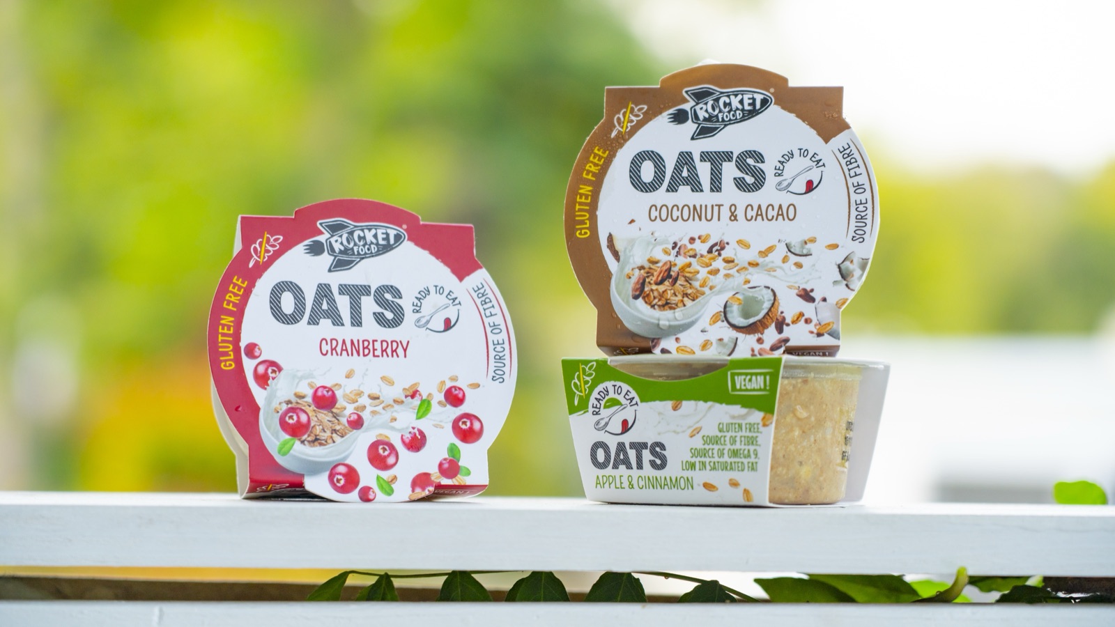 Three packaged chilled breakfast products with prepared overnight oats
